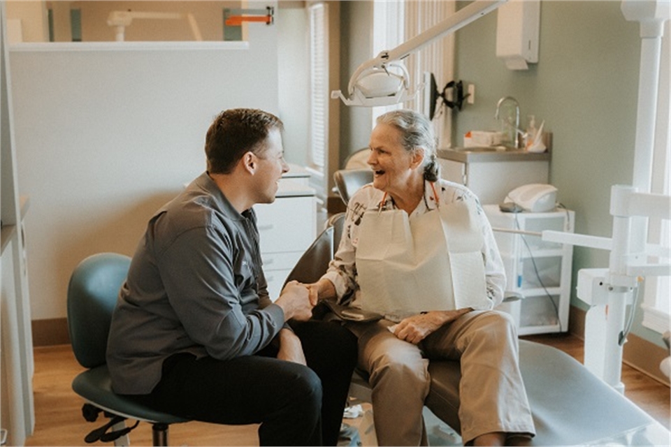 Magnolia Family Dentistry Dr. Christopher A. Hamm talking with Patient