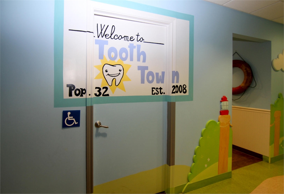 City welcome signage themed operatory entrance at Smiles of Austin