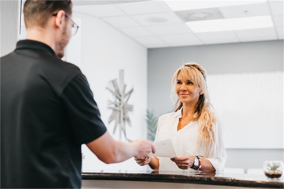 Reception desk handling dental patients at Element Dental by Nicholas Pile DMD