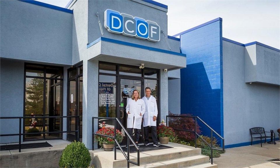 Dentists smiling outside of Dental Center of Florence