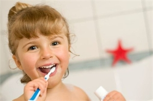 Happy Child Brushing Teeth