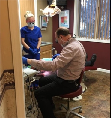 Glenmont NY family dentist Dr. Michael V Conte DDS performing dental treatment at Glenmont Dental