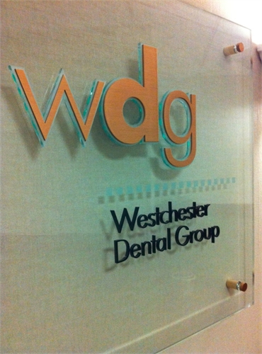 Glass signage on wall at White Plains dentist Westchester Dental Group