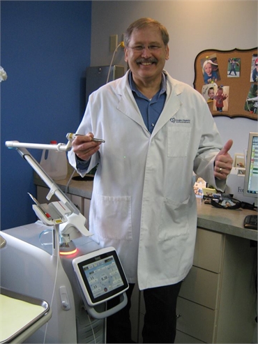 Elkhart dentist Douglas J. Snyder DDS with his Lightwalker Laser