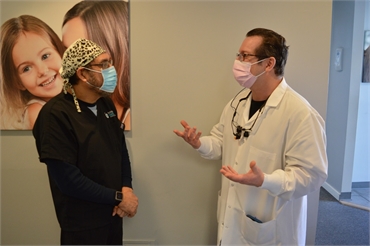 Elizabeth dentist Dr. Joseph Banker talking to dental hygienist at Banker Dental Associates