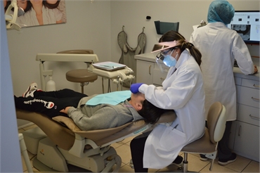 Elizabeth dentist Dr. Pham working on dental implants patient at Banker Dental Associates