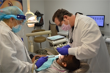 Elizabeth dentist Dr. Jonathan Banker working on dental veneers patient at Banker Dental Associates