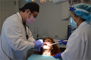 Elizabeth dentist Dr. Banker working on root canal patient at Banker Dental Associates