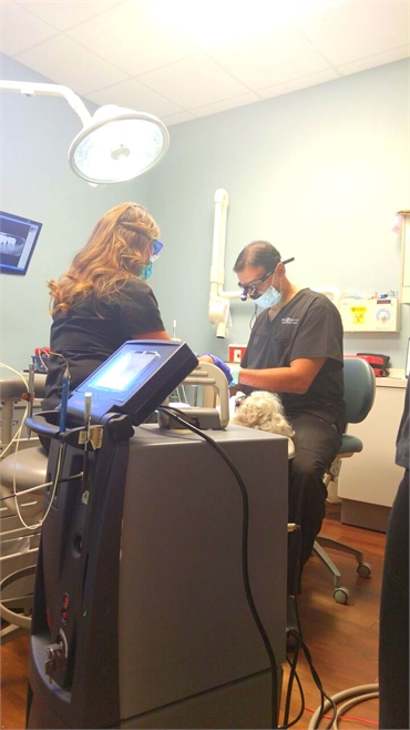 Dr Tadros performing tooth extraction at Dental Implant Solutionz FL 33771