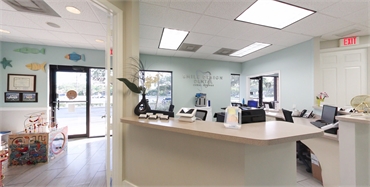 Reception and kids area at Smile Design Dental of Coral Springs