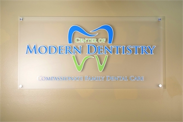 Signage of Center of Modern Dentistry on the front wall of our dental clinic in Rancho Cucamonga CA