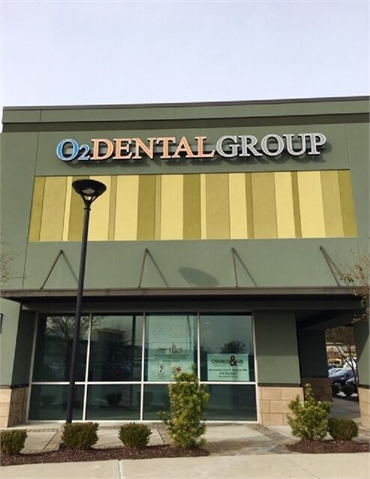 Signboard over store front at O2 Dental Group of Fayetteville