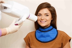 Lead aprons can protect the thyroid gland while taking a periapical x-ray at the dental office.
