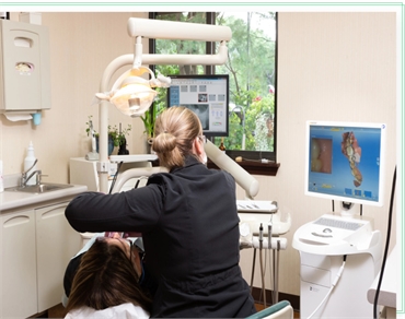 Dental assistant working on dental crowns patient at Zubkov Dental