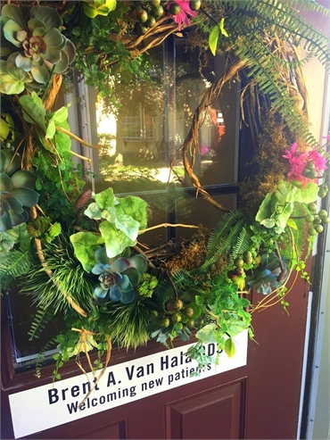 Signage of Hudson dentist Dr Brent Van Hala on the entrance door at the office of Van Hala Dental Gr