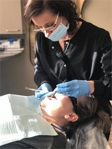 Dental hygienist at work at Cascade Dental Care - North Spokane