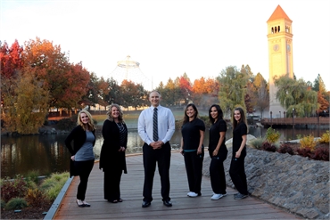 Dental Care of Spokane team photo session against the backdrop of Riverfront Park and The Great Nort