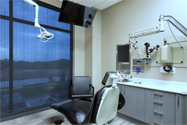 Comfortable dental chair and nice view of the outside at dental implants specialist  Gordon Dental K