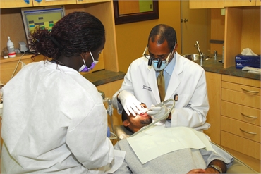 Washington DC dentist Dr. Hines performing root canal treatment at Premier Dental Care