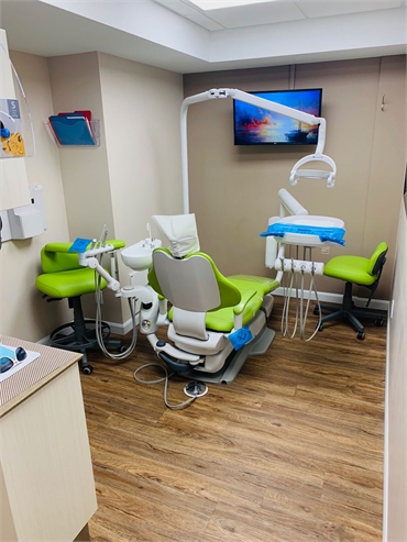 Green dental treatment room-hygiene - Lakefront Family Dental