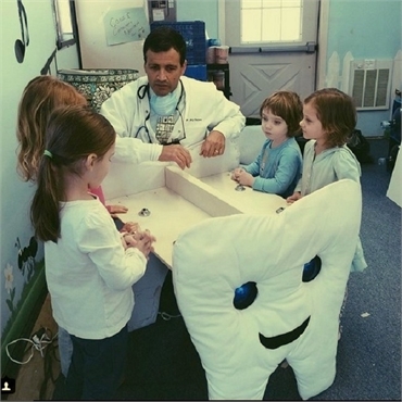 Long Valley dentist Dr. Jay Cazes interacts with children at Cazes Family Dentistry LLC