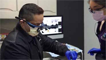 Laredo dentist Dr. Johnny Cavazos working on dental implants procedure at Ahh Smile Family Dentistry