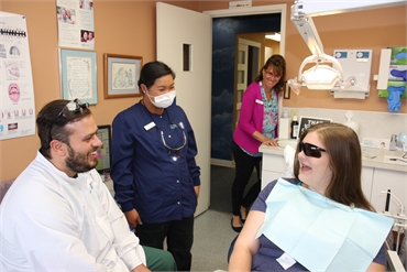 Bremerton dentist Dr. Keegan Waldo talks to dental crown patient at Current Dental