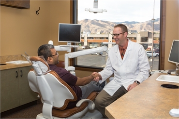 East Wenatchee dentist Dr. James Webb explaining dental implant options to patient at Webb Dental Ca