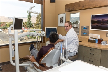East Wenatchee dentist Dr. James Web explaining dental crown options to patient at Webb Dental Care