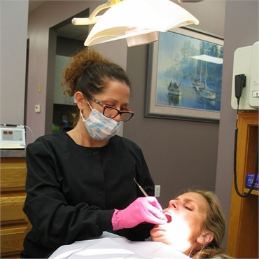 Dental hygienist at work at Dr. Aiello's office in Clinton Township