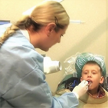 Dental hygienist at work at Orangeburg dental implant center Orangetown Smiles