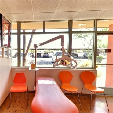 Brightly colored dental chair at Kids Dental Center