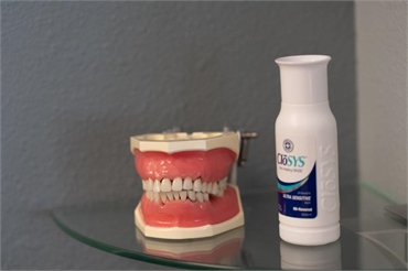 Dental model and CloSYS sensitive mouthwash at Radiant Family Dentistry