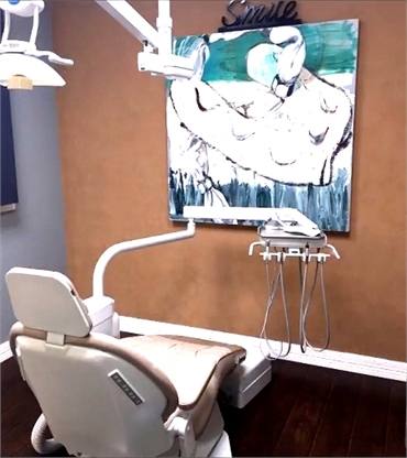 Art display in front of dental chair at Allen dentist All Smiles Dentistry