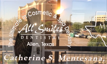 Signage on the glass panel on the entrance door at All Smiles Dentistry Allen TX