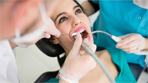 Dentist treating a patient in the dental office