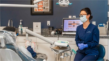 Dental hygienist and cosmetic dentistry patient sharing lighter moments at Family Dental Choice
