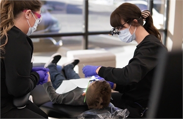 Airway Heights kid's dentist Dr. Amy Cochran performing root canal at Dr. C Kids Dentistry