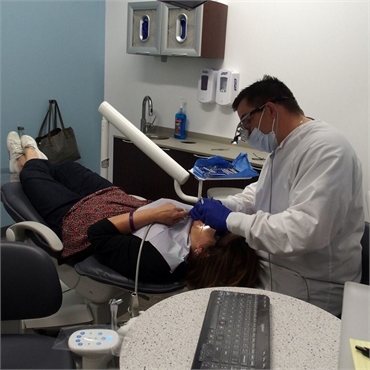 Hugo cosmetic dentist Brent Sorenson DDS working on one of his patients at Sorenson Dental Hugo MN 5