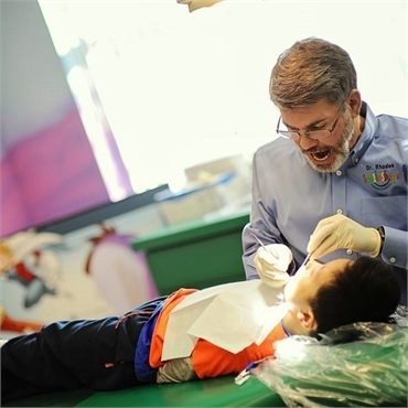 Dr. Rhodes at work at Smile Shoppe Pediatric Dentistry Rogers AR
