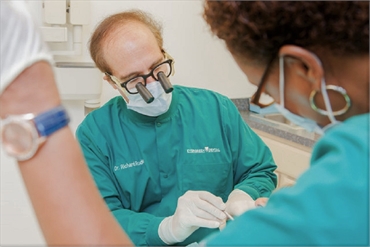 Dr. Richard D. Ruden performing dental implant procedure at Premiere Dental of West Deptford