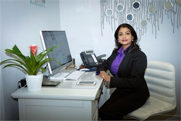 Best San Jose veneers specialist Dr. Sudeep in her consultation room at Santa Teresa Dental Center