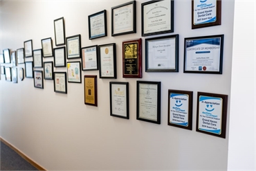 Accolades and certifications display at Grand Haven Dental Care