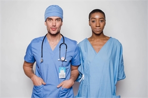 Medical doctor posing with the female medical assistant in professional clothing style