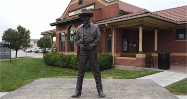 Matt Dillon Statue at 8 minutes drive to the south of Dodge City dentist Hrencher Dental