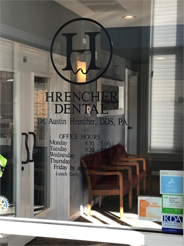 Signage on glass pane at Hrencher Dental Dodge City