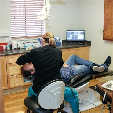Dental hygienist at work at Hampden Family Dental