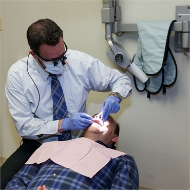 Denver dentist Dr. Ross of Hampden Family Dental working on dentures