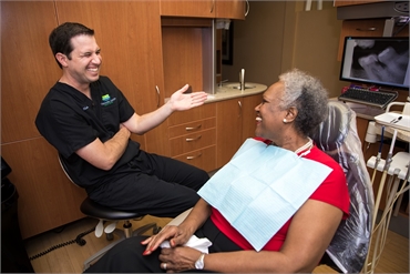 Dr. Kiskaddon having lighter moments with dentures patient at Clearwater Dental Associates