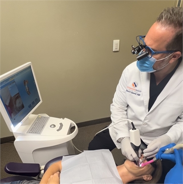 Las Vegas dentist Dr. Richard Racanelli working on dental crown procedure using Sirona CEREC intraor